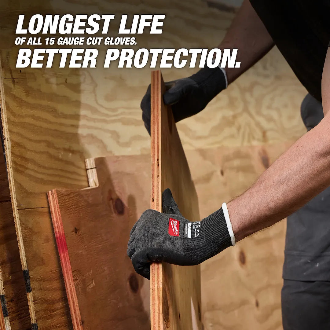 Hands wearing Milwaukee Cut Level 1 Nitrile Dipped Gloves lifting plywood