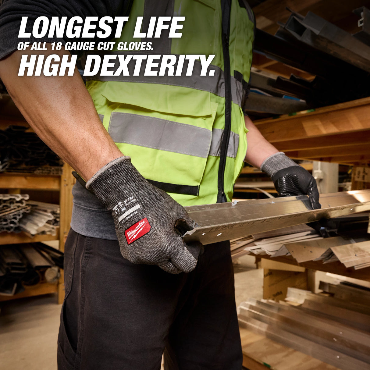 Worker wearing Milwaukee Cut Level 4 High Dexterity gloves holding metal beam