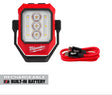 A red and black Milwaukee portable LED work light with a built-in rechargeable battery, shown alongside a red USB-C charging cable on a white background with a 'RECHARGEABLE BUILT-IN BATTERY' badge.