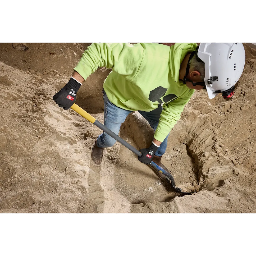 Worker digging with shovel wearing Milwaukee Cut Level 1 Nitrile Dipped Gloves
