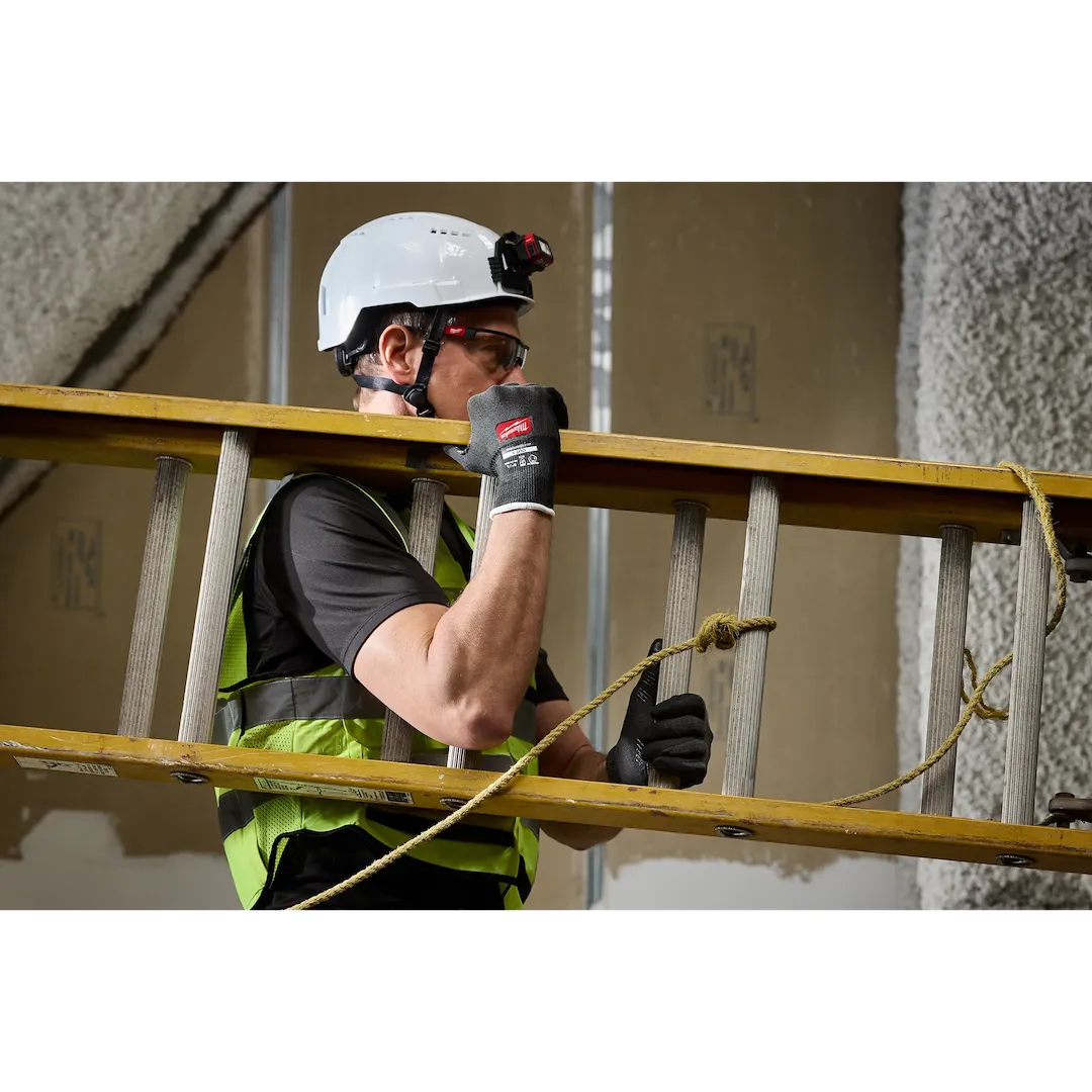 Worker carrying ladder wearing Milwaukee Cut Level 1 Nitrile Dipped Gloves