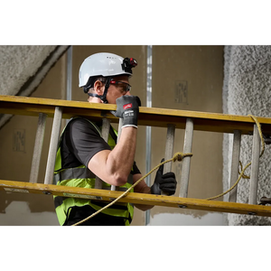 Worker carrying ladder wearing Milwaukee Cut Level 1 Nitrile Dipped Gloves