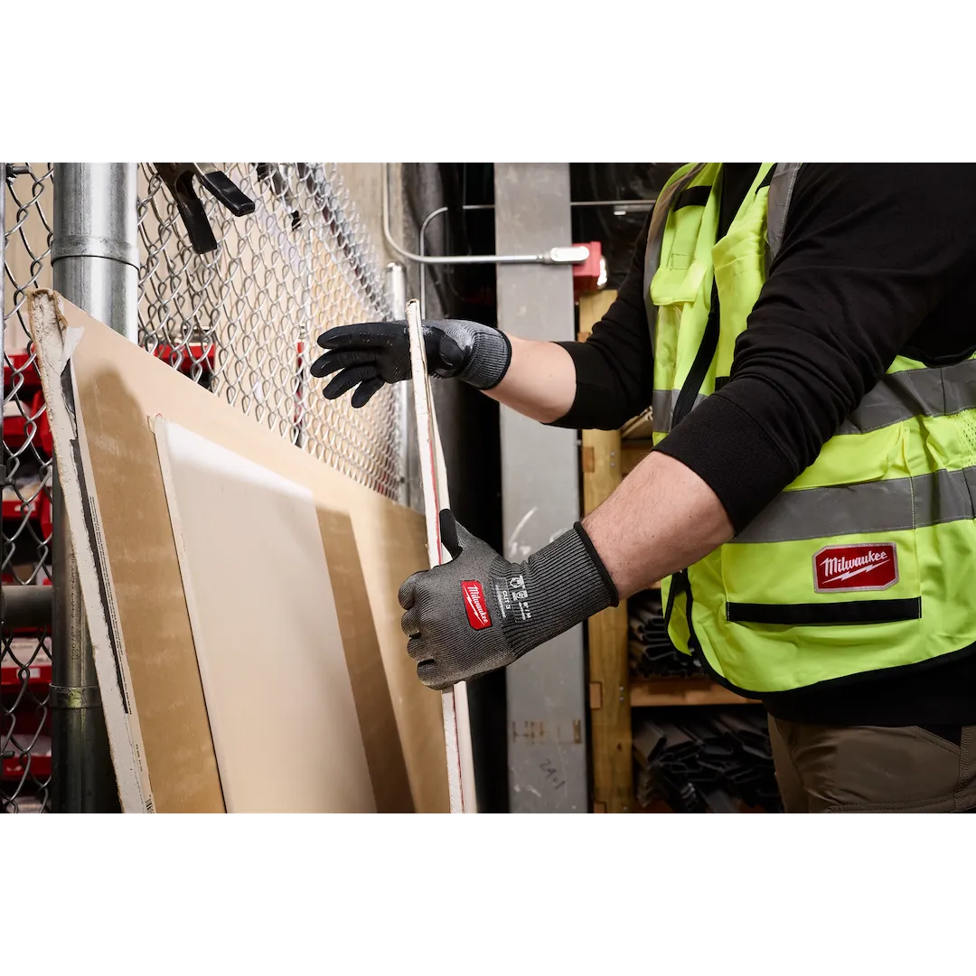 Worker handling boards wearing Milwaukee Cut Level 3 High Dexterity gloves