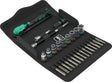 Set of tools including screwdrivers and bits on a black tray with a white background