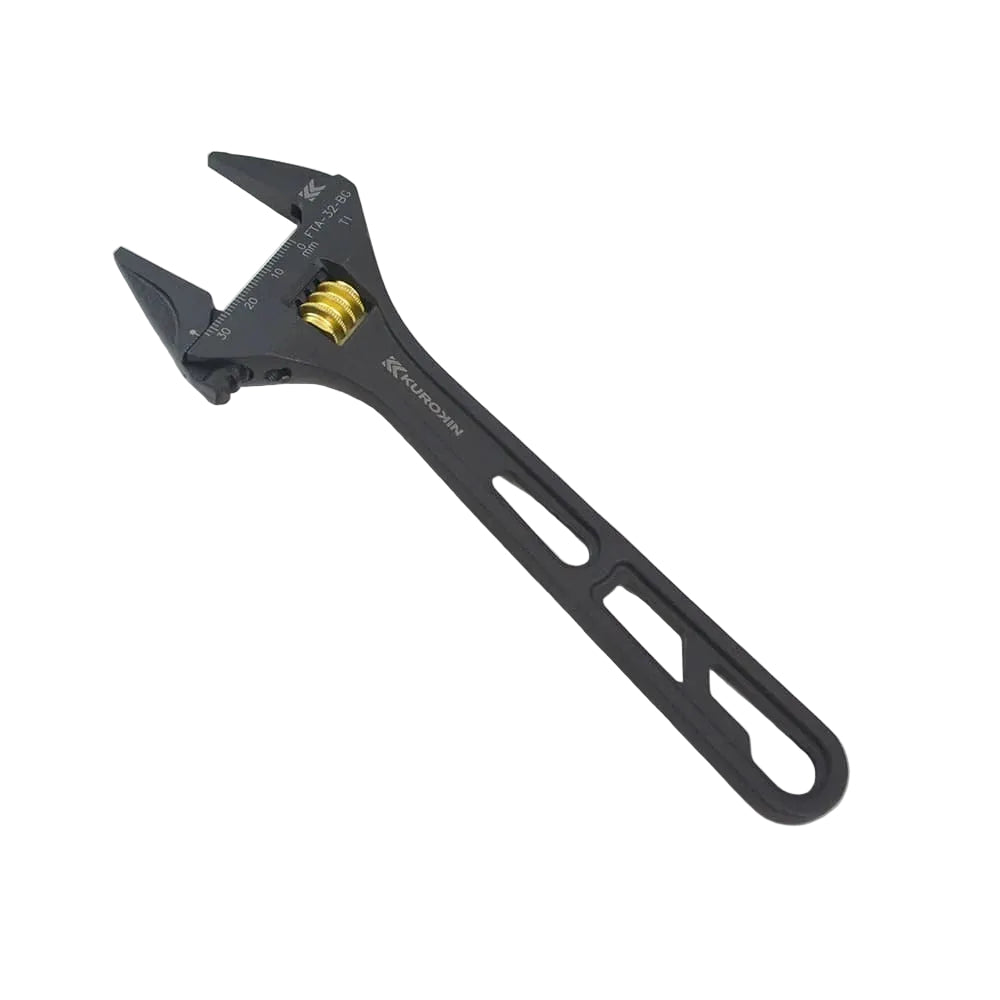 Black adjustable wrench on a light gray background