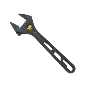 Black adjustable wrench on a light gray background