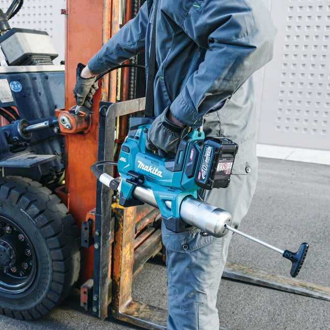 Person using a Makita power tool on a forklift in an industrial setting