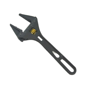 Black adjustable wrench on a light gray background