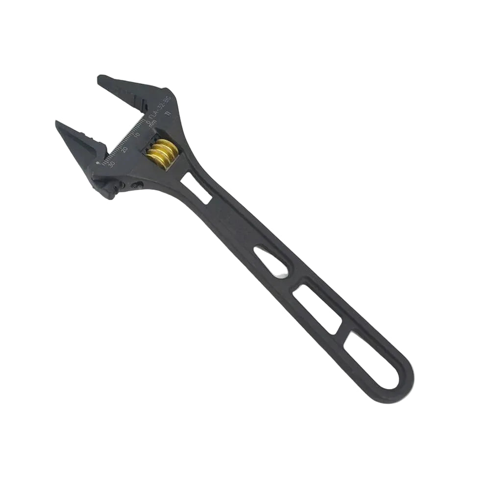 Black adjustable wrench on a light gray background