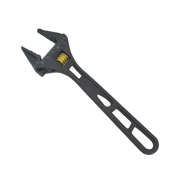 Black adjustable wrench on a light gray background